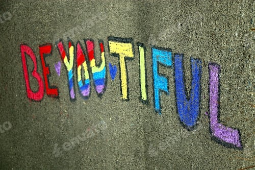 Preview: Be-You-Tiful: The word beautiful written in chalk on a concrete exterior in honor of Pride.