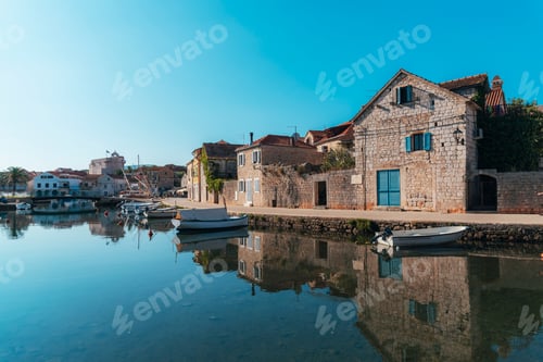 Preview: Vrboska village embankment, houses are reflected in the water. Hvar island, Croatia