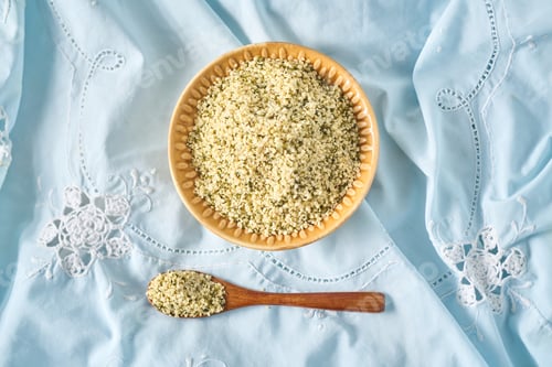 Preview: Shelled hemp seeds in a bowl with spoon