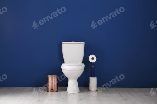 Preview: Simple bathroom interior with new toilet bowl near color wall
