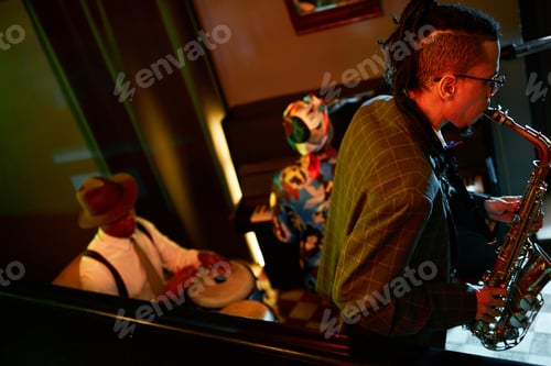 Preview: Male Saxophonist Playing Jazz with Music Band in Bar under Neon Light