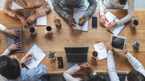 Preview: Multiracial business team having meeting, top view