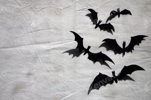 Preview: Background for Halloween. Paper bats on a dirty sheet.