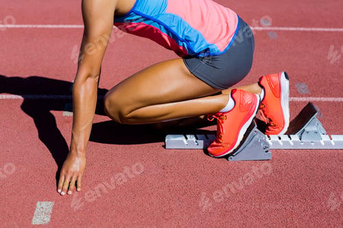 Preview: Female athlete ready to run on running track