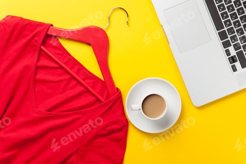 Preview: Flat Lay of Red Blouse and Laptop