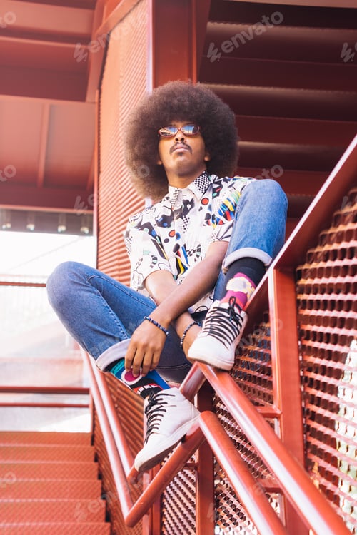 Preview: young black guy with afro hair and sunglasses