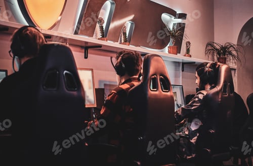 Preview: Teenagers are playing videogames at internet club