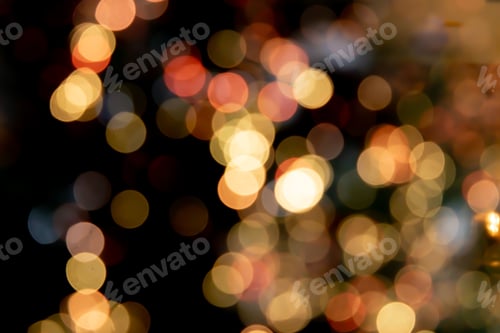 Preview: Dark background with a vibrant display of multicolored bokeh lights.