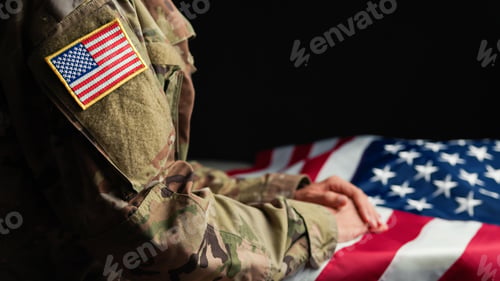 Preview: Hand of a Veteran touching stars of USA flag