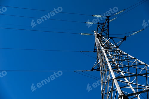 Preview: Modern high voltage tower against blue sky, low angle view