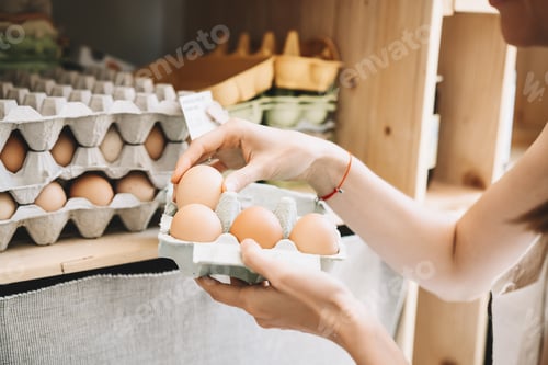 Preview: Zero waste shop. Woman buying in plastic free grocery store.
