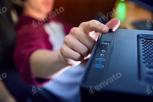 Preview: Close Up Of Man Gaming At Home Turning Power Switch On Computer On Or Off