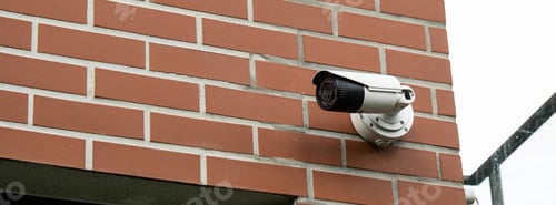 Preview: Close-up Of Security Camera On private building. Focus on security CCTV camera monitoring system