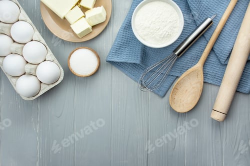 Preview: Ingredients and kitchen utensils for making homemade cakes. Home kitchen. Copy space. Flat lay.