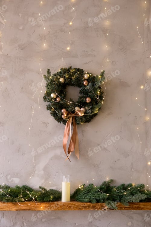 Preview: Home New Year's kitchen interior. Decorations with garlands and a Christmas wreath.