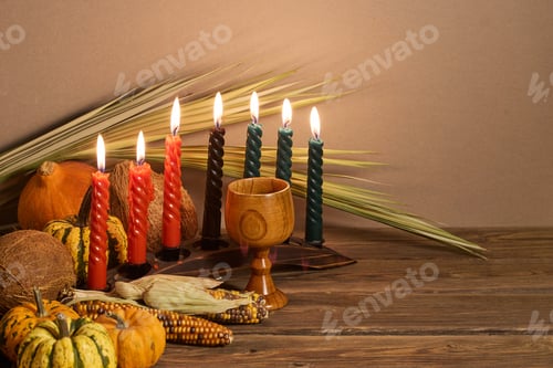 Preview: Kwanzaa Celebration Setup. A festive Kwanzaa display with candles, fruits, and decorative elements