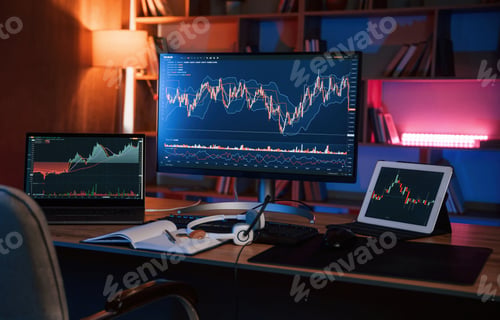 Preview: Computer with stock exchange graph on display is in the dark room with neon lighting