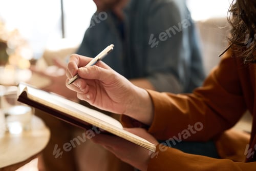 Preview: Therapist making notes in notepad