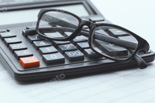 Preview: Business still life with calculator on table in office.