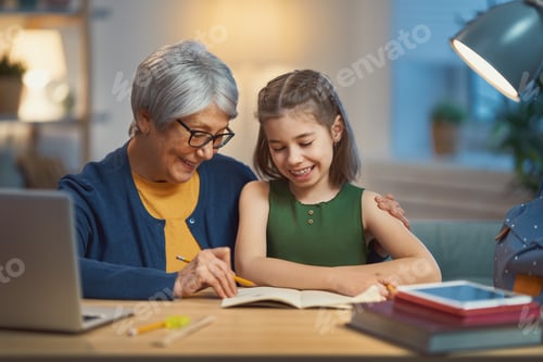 Preview: Girl studying with grandma.