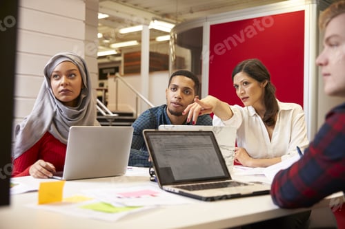 Preview: Group Of Students Meeting For Tutorial With Teacher