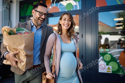 Preview: Happy pregnant woman and her husband leaving the supermarket after buying groceries.