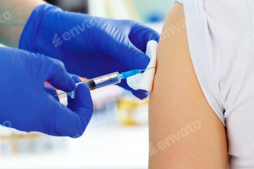 Preview: Doctor hands making a vaccination in the shoulder of patient