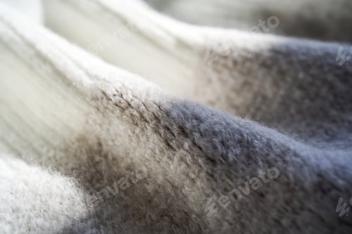 Preview: The texture of a warm sweater with a beige pattern.