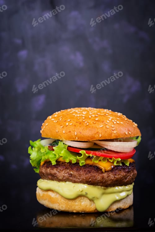 Preview: Delicious handmade burger on dark background. Close view