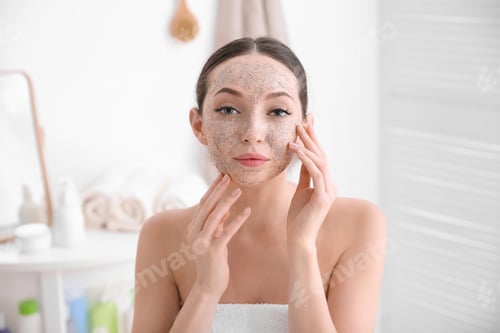 Preview: Woman with scrub on face in bathroom