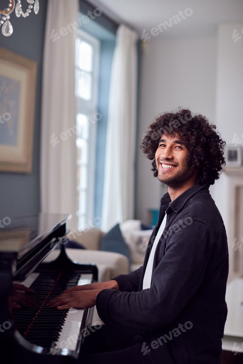Preview: Young Man Sitting At Grand Piano And Playing At Home