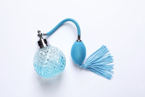 Preview: Bottle of perfume on white background, top view