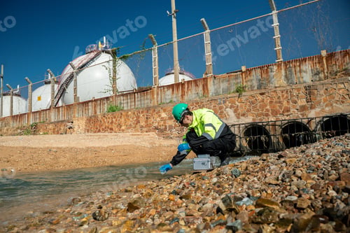 Preview: Scientist or engineer wearing protective uniform and glove under working water analysis and water qu