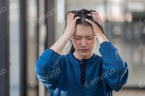 Preview: Portrait of tired young business Asian woman work with documents tax laptop computer in office. Sad,