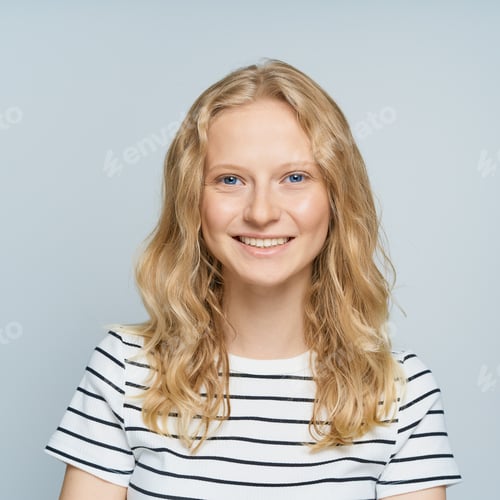 Preview: Beautiful young smiling blonde woman without makeup on white wall