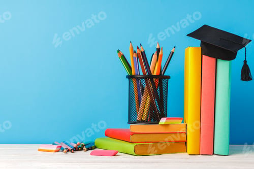 Preview: Cup of color pencils and stack of books
