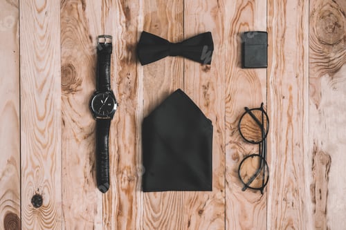 Preview: top view of stylish accessories collection on wooden tabletop