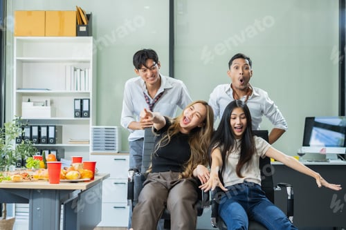 Preview: Celebration successful deal and pizza in the workplace.