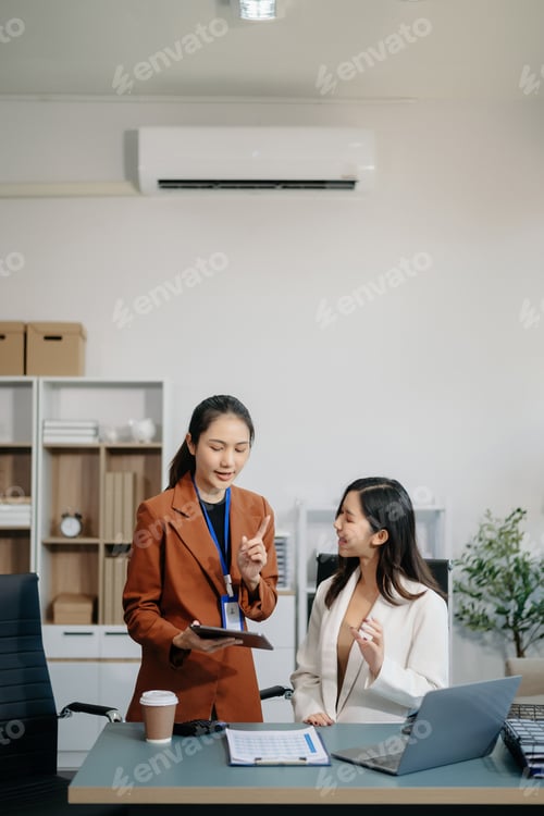 Preview: Businesswomen work and discuss their business plans. A Human employee explains and shows her