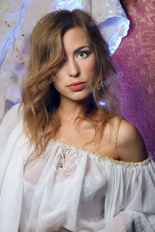Vista previa: Pretty mystic lady in gothic white dress in underground dungeon