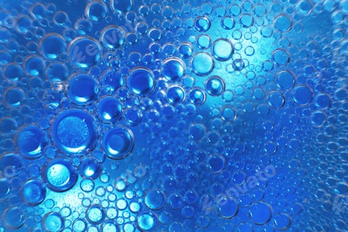 Preview: abstract light blue background with oil circles . bubbles of water close up