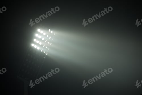 Preview: Soccer Stadium Lights Reflectors Against Black Background