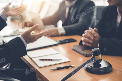 Preview: Businessman and lawyer discuss lawsuits in the office.