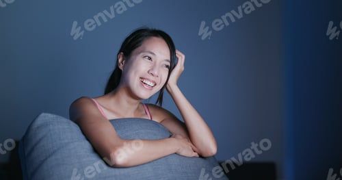 Preview: Woman watching video on computer at night
