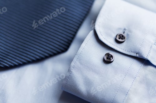 Preview: close up of shirt and blue patterned tie