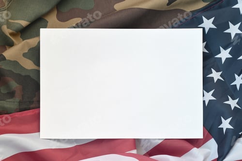 Preview: Blank paper lies on United States of America flag and folded mil