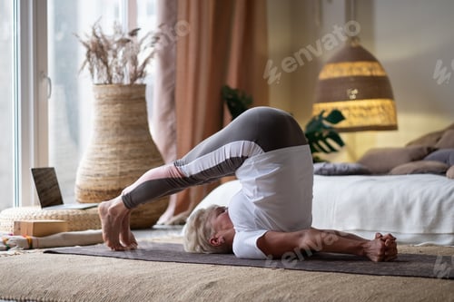 Preview: Woman Doing Yoga at Home on Mat