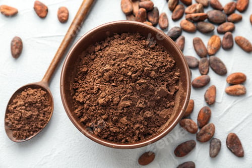 Preview: Flat lay composition with cocoa powder and beans on light background