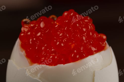 Preview: Boiled egg with red caviar, close-up