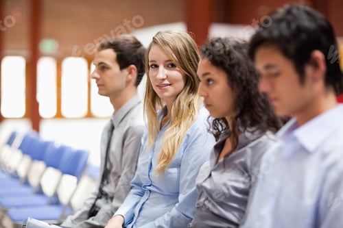 Preview: Young Businesswoman Smiling At The Camera During A Presentation
